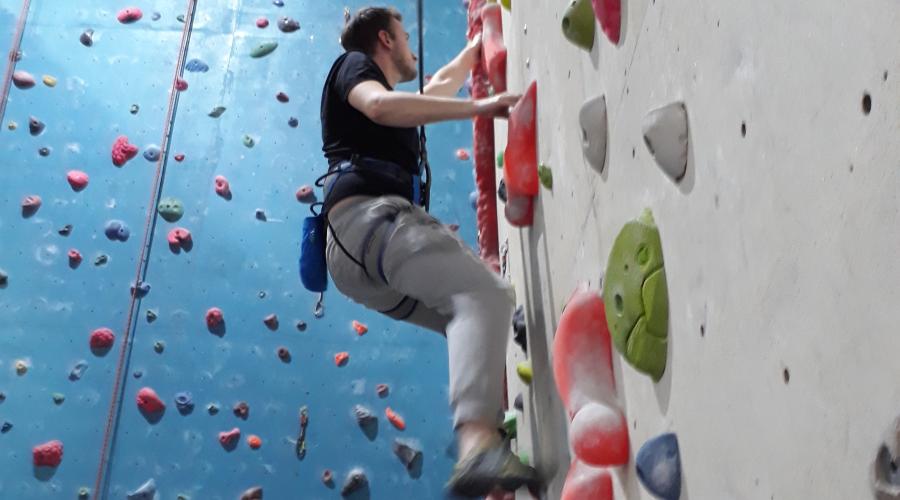 Wide shot of climber on wall