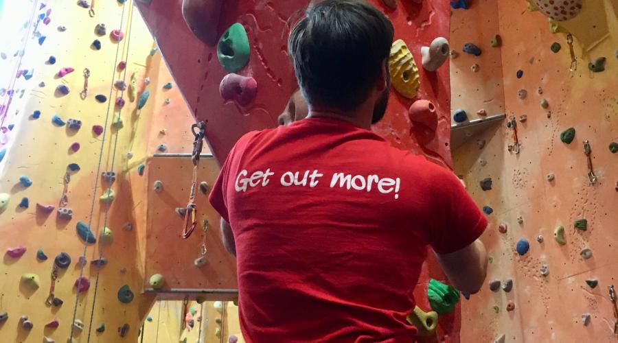 Two smiling climbers at Redpoint climbing centre