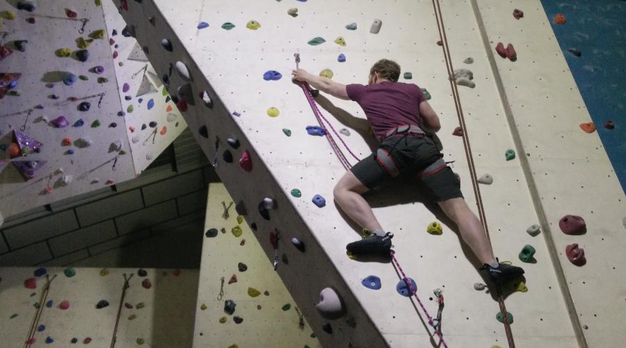 Wide shot of climber on wall