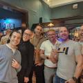 Guys with flag at cafe